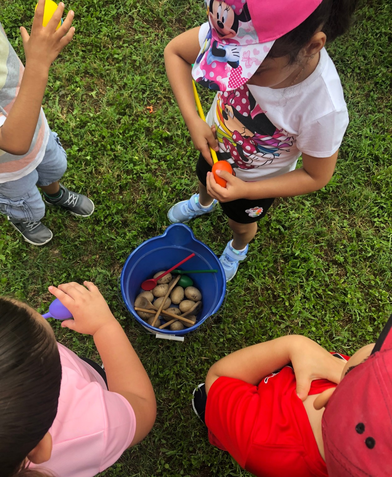 Children selecting eggs from a bucket